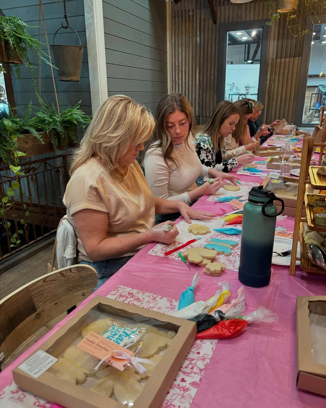 Class participants decorating cookies together